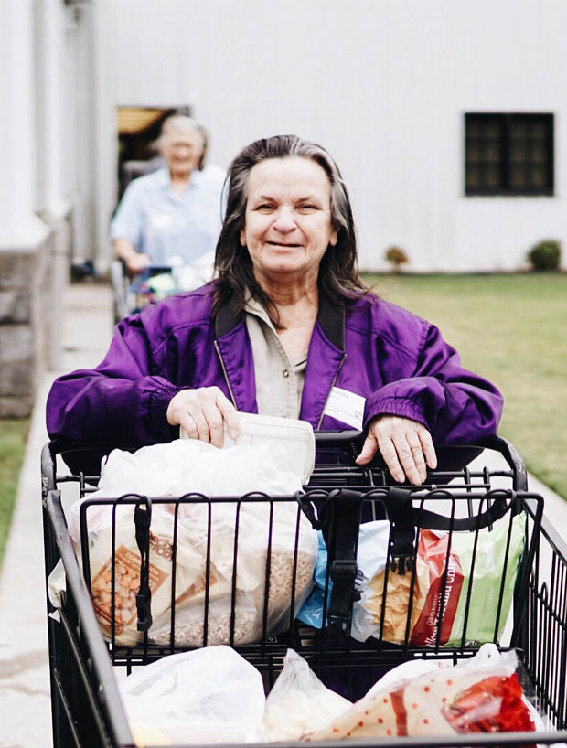 Woman pushing shopping cart